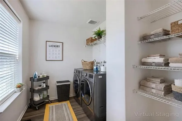 a bathroom with a sink vanity mirror and toilet