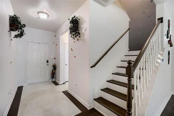 a view of entryway with wooden floor