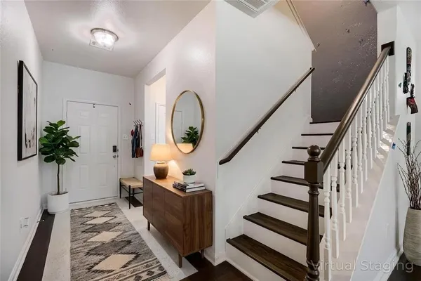 a view of entryway with wooden floor