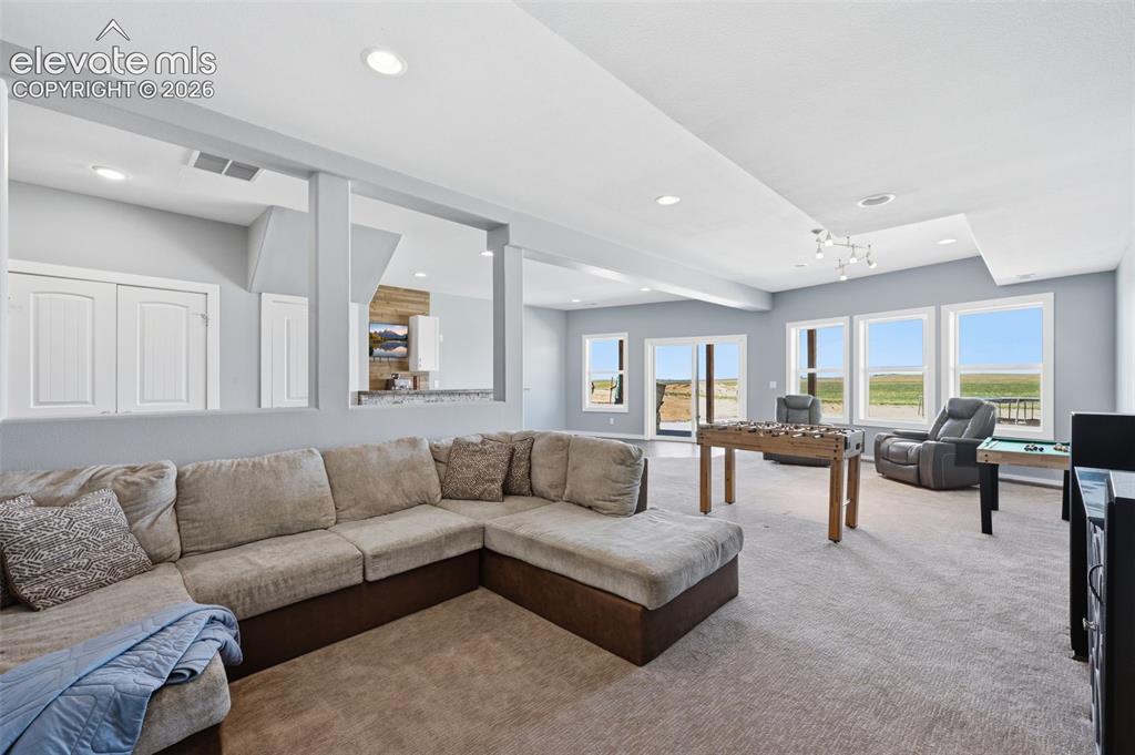 23335 Sanborn Road Calhan, CO 80808 - Photo 18 of 28 Spacious walkout basement with flexible living possibilities