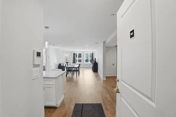 a view of a livingroom with furniture and hardwood floor