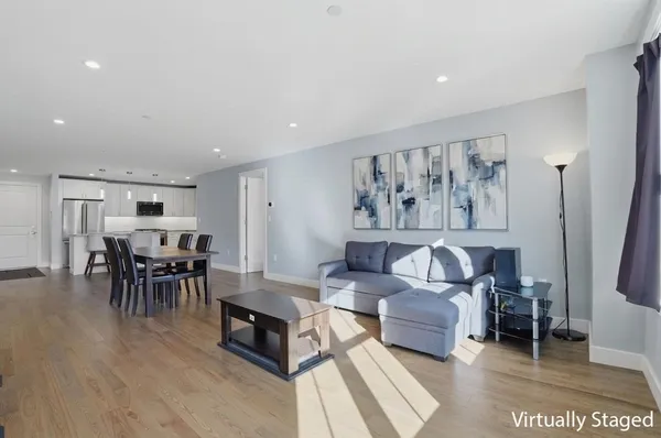 a living room with furniture and a table