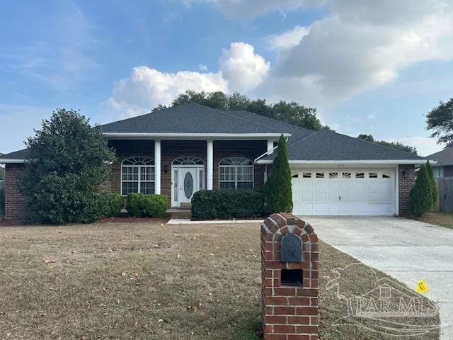 a front view of a house with garden
