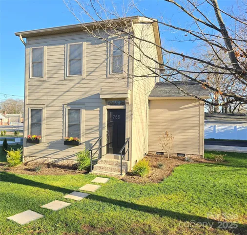 front view of a house with a yard