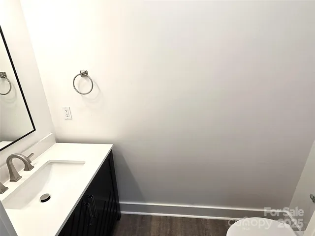 a bathroom with a sink toilet and vanity