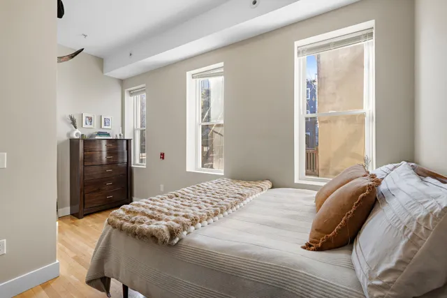 a bedroom with a bed and a closet