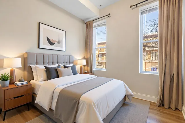 a bedroom with bed and a window