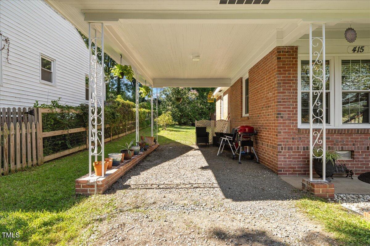 415 Edward Street Durham, NC 27701 - Photo 17 of 27 a view of a porch with furniture and garden