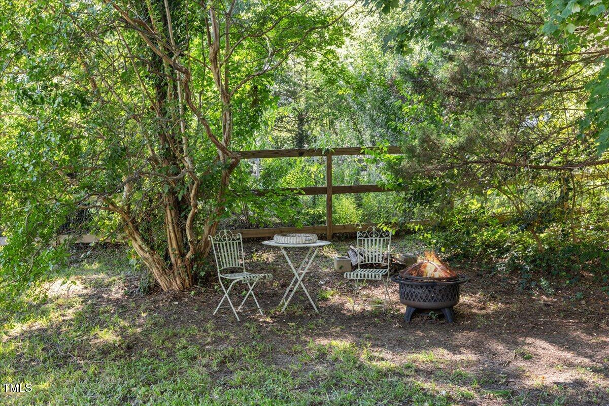 415 Edward Street Durham, NC 27701 - Photo 22 of 27 a backyard of a house with table and chairs