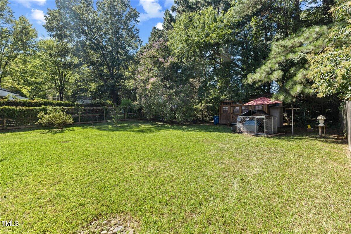 415 Edward Street Durham, NC 27701 - Photo 24 of 27 a view of a house with a yard and sitting area