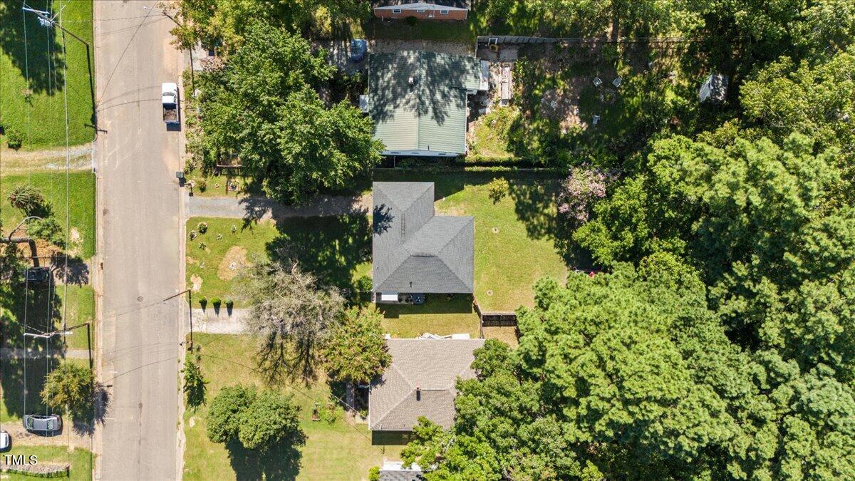 415 Edward Street Durham, NC 27701 - Photo 26 of 27 an aerial view of a house with a yard and large trees