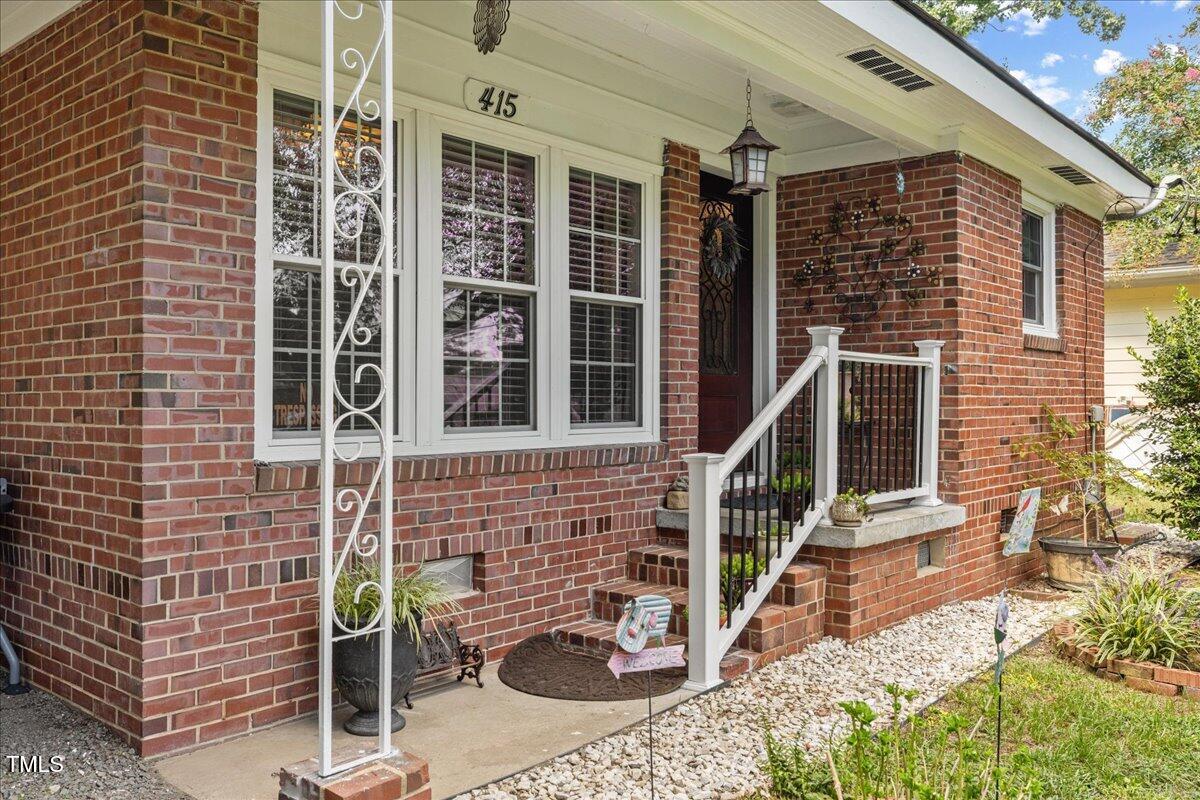 415 Edward Street Durham, NC 27701 - Photo 3 of 27 a front view of a house with glass windows