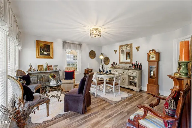 a view of a livingroom with furniture and a flat screen tv