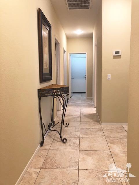 1255 Palmas Ridge Palm Springs, CA 92262 - Photo 12 of 34 a view of a livingroom with table and chair