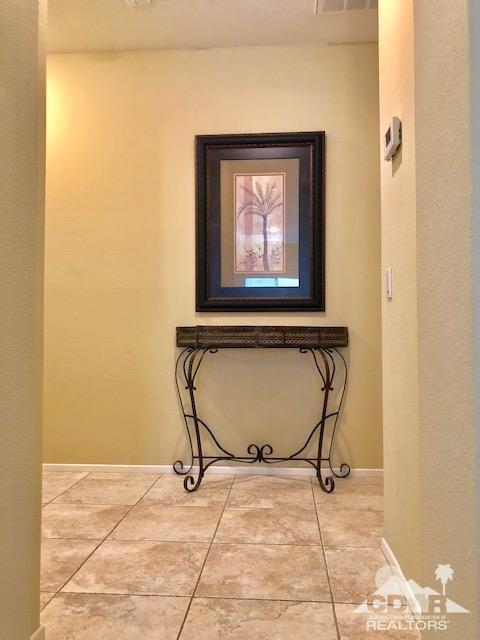 1255 Palmas Ridge Palm Springs, CA 92262 - Photo 13 of 34 a view of an empty room with wooden floor and a window