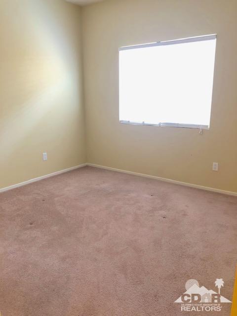 1255 Palmas Ridge Palm Springs, CA 92262 - Photo 22 of 34 an empty room with a window