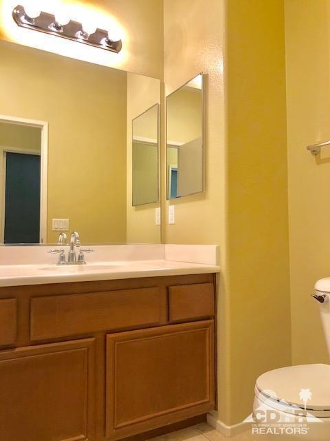 1255 Palmas Ridge Palm Springs, CA 92262 - Photo 23 of 34 a bathroom with a sink and a mirror