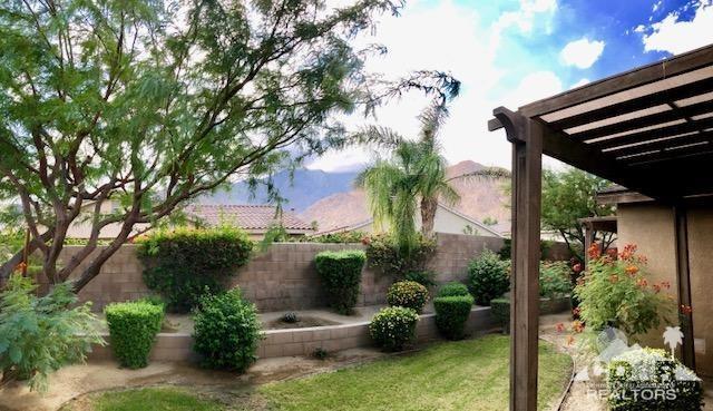1255 Palmas Ridge Palm Springs, CA 92262 - Photo 29 of 34 a view of a chair and table in the patio