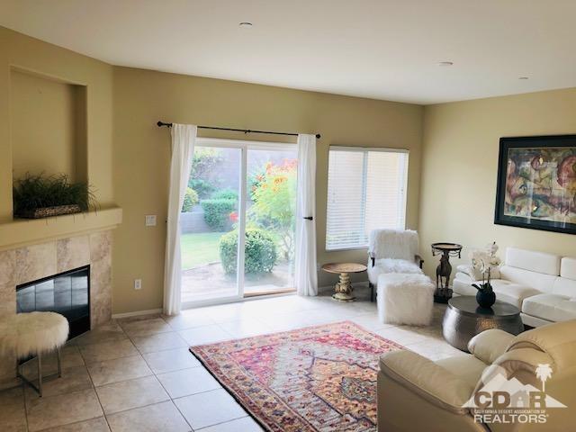 1255 Palmas Ridge Palm Springs, CA 92262 - Photo 4 of 34 a living room with furniture and a flat screen tv