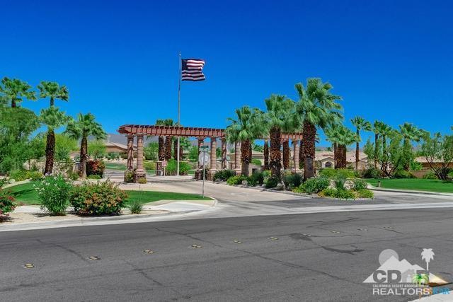 1255 Palmas Ridge Palm Springs, CA 92262 - Photo 32 of 34 a front view of a house with a yard