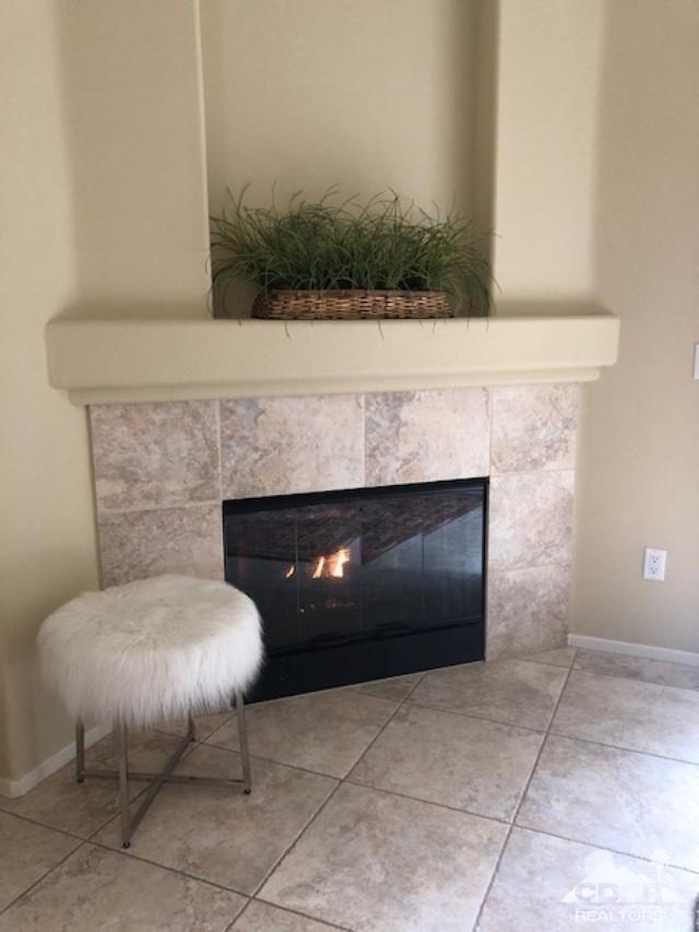 1255 Palmas Ridge Palm Springs, CA 92262 - Photo 5 of 34 a fireplace with a chair