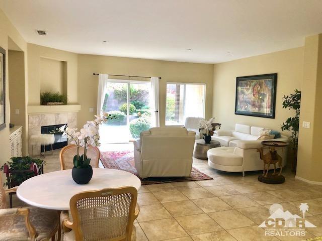 1255 Palmas Ridge Palm Springs, CA 92262 - Photo 6 of 34 a living room with fireplace furniture and a large window