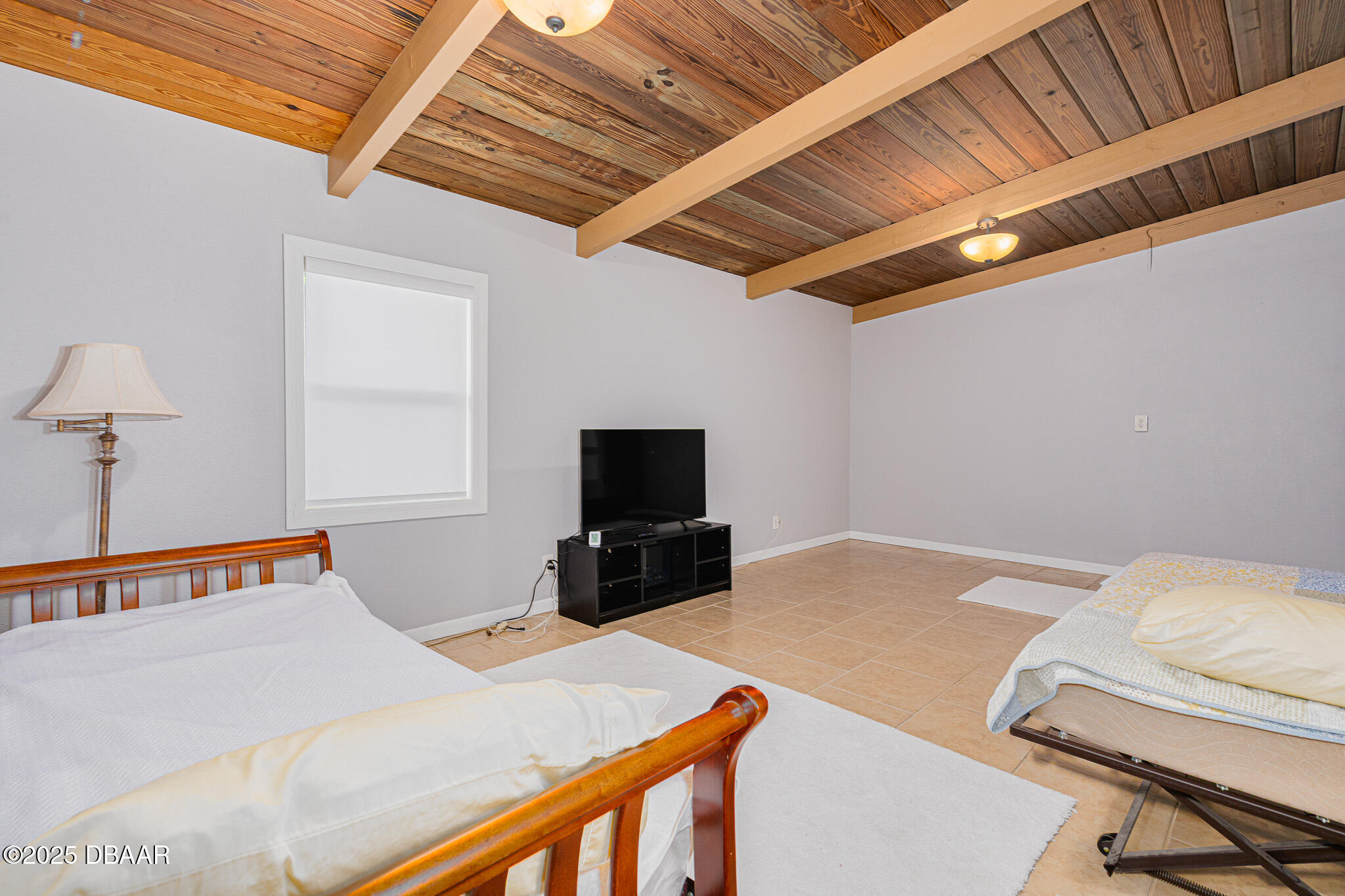 46 Oceanview Avenue Ponce Inlet, FL 32127 - Photo 35 of 79 a bedroom with a bed and a television