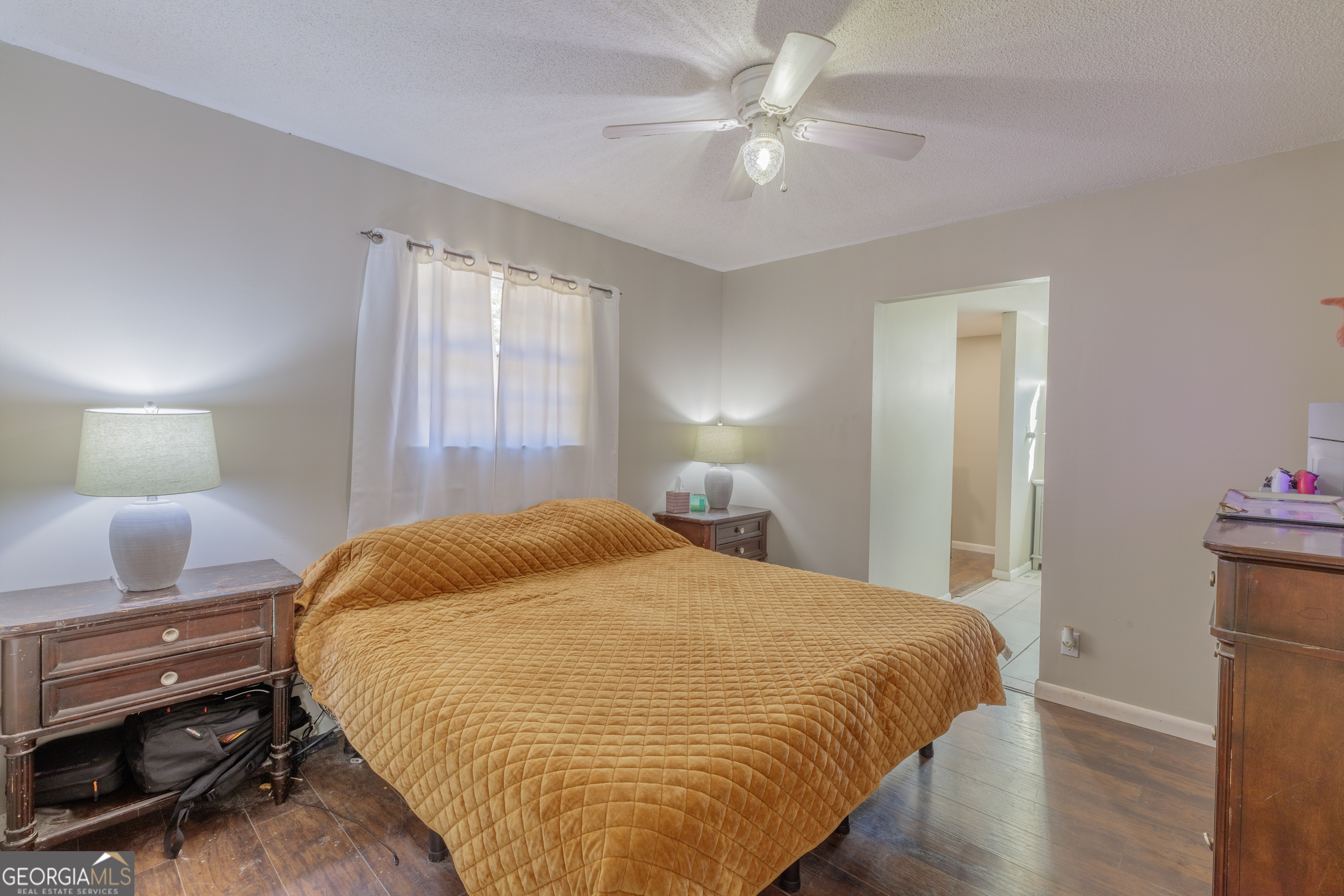 1144 Ridgeway Road LaFayette, GA 30728 - Photo 10 of 66 a bedroom with a bed and a chandelier