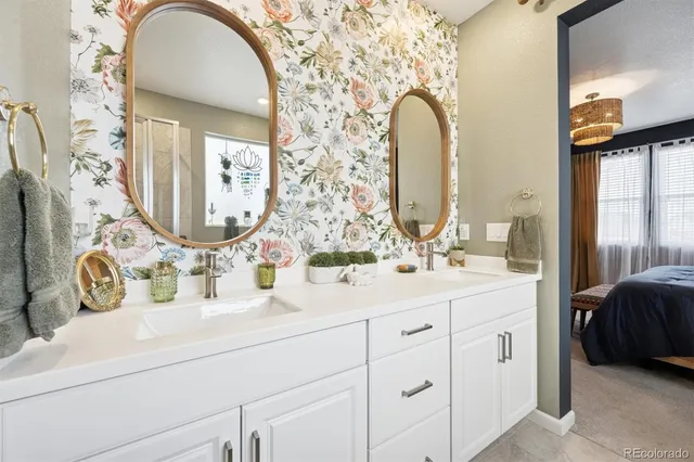 a bathroom with a double vanity sink and a mirror