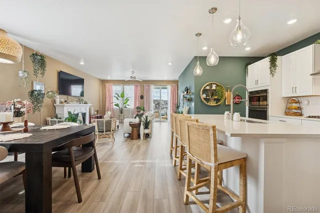 a view of a kitchen with cabinets and wooden floor