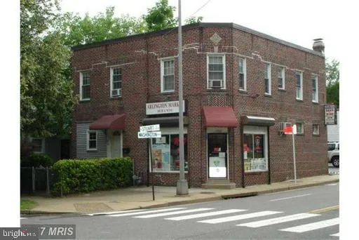 a view of a brick building with large windows