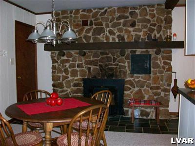 545 Clearfield Road Nazareth, PA 18064 - Photo 9 of 11 a view of a dining room with furniture and chandelier