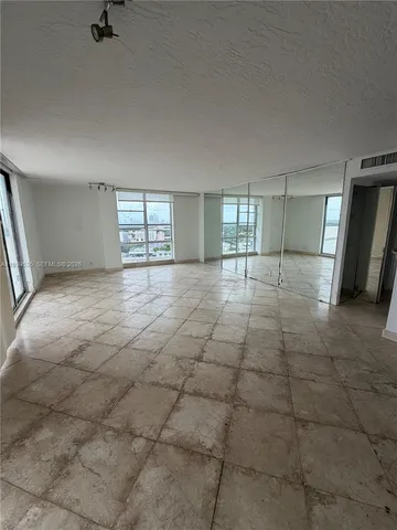 en empty room with windows