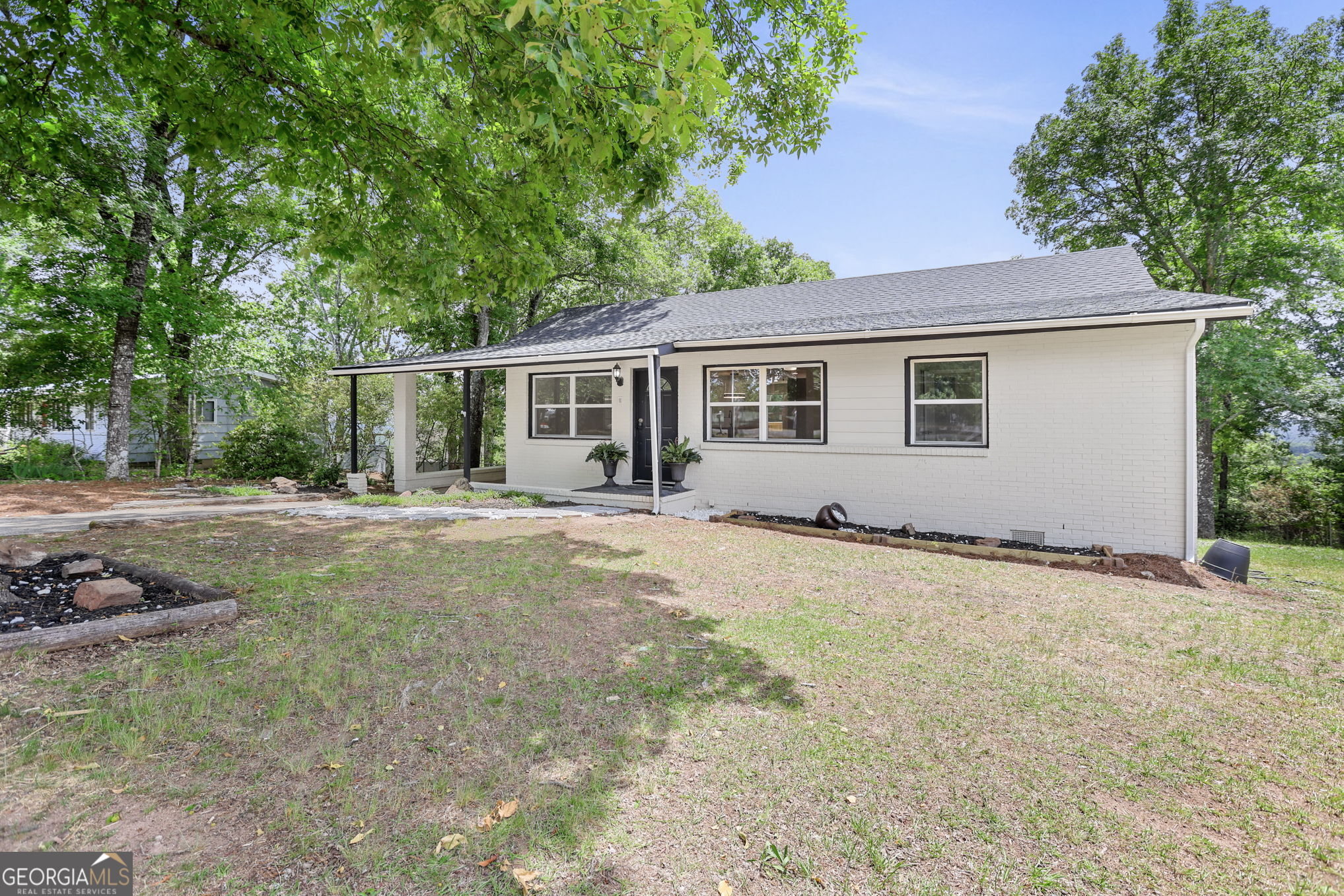 7060 Scenic Heights Road Manchester, GA 31816 - Photo 42 of 52 a backyard of a house with yard and outdoor seating