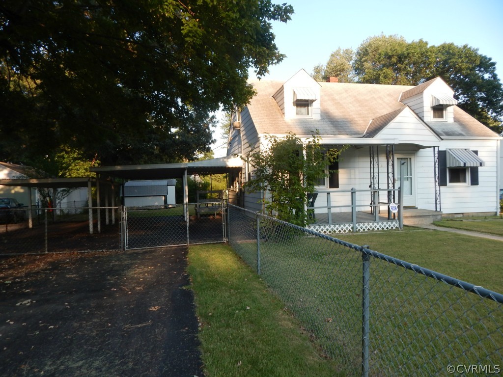 a backyard of a house with table and chairs