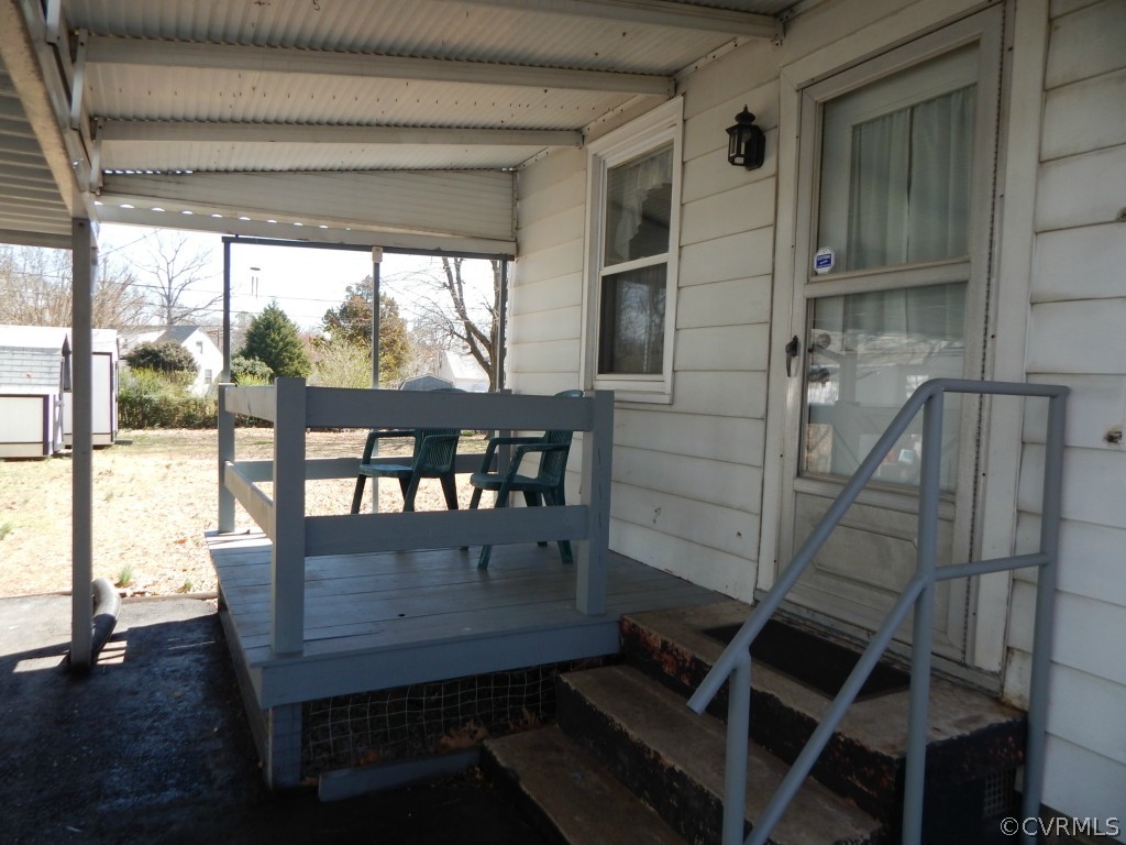6723 Strathmore Road North Chesterfield, VA 23237 - Photo 11 of 15 a view of a porch with furniture and wooden floor