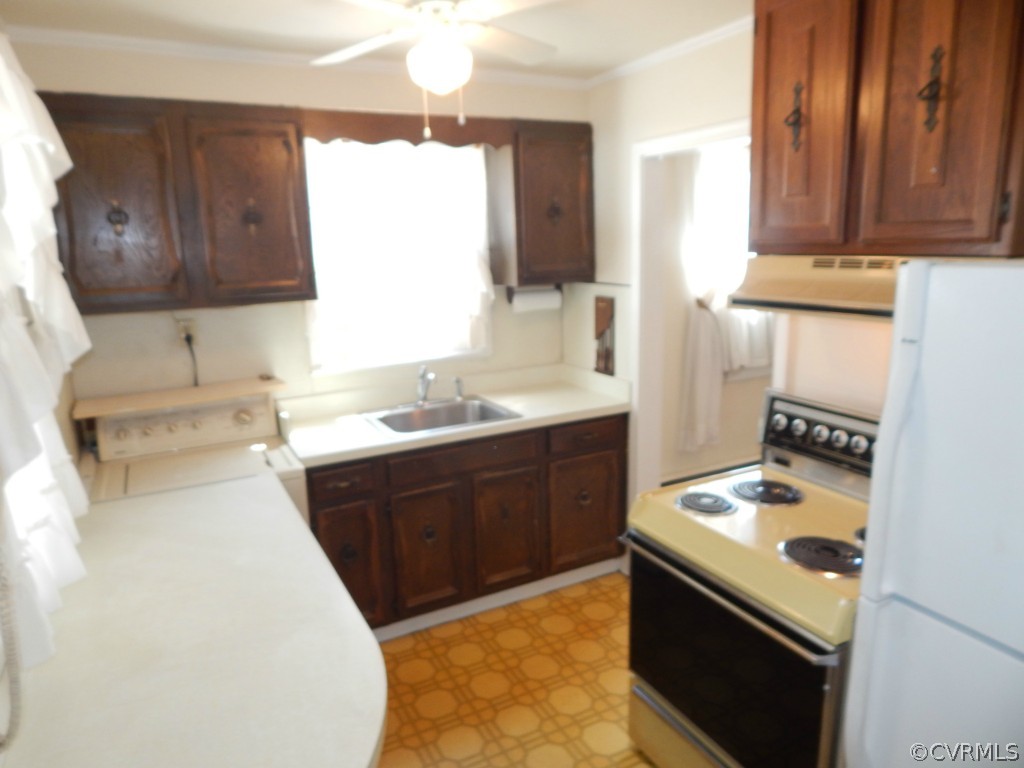 6723 Strathmore Road North Chesterfield, VA 23237 - Photo 4 of 15 a kitchen with a sink stove and cabinets
