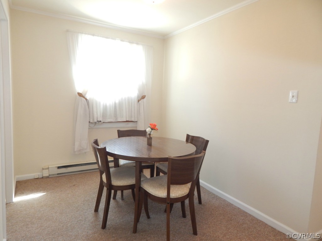 6723 Strathmore Road North Chesterfield, VA 23237 - Photo 5 of 15 a view of a dining room with furniture and a window