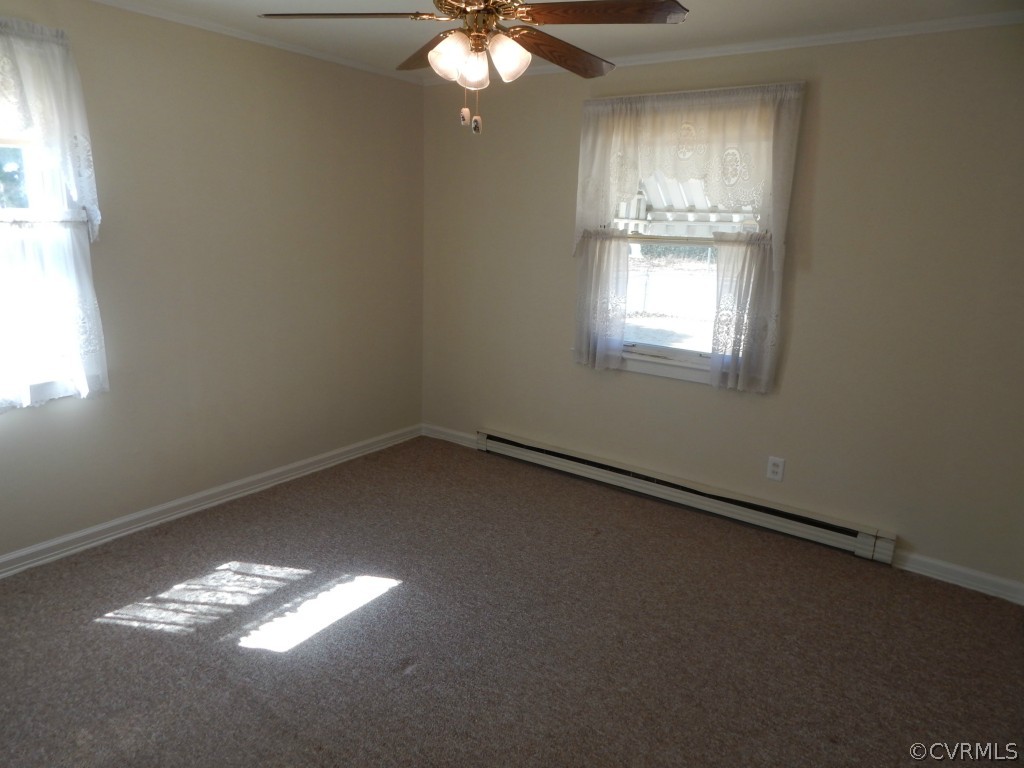 6723 Strathmore Road North Chesterfield, VA 23237 - Photo 6 of 15 en empty room with windows and chandelier fan