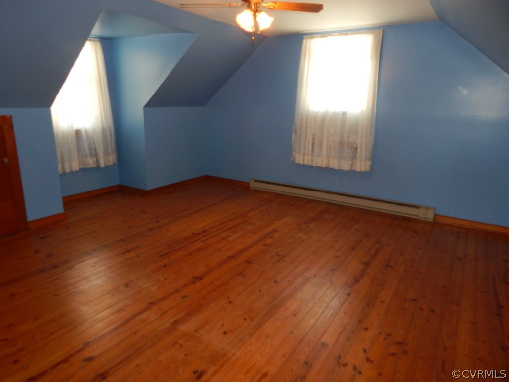 6723 Strathmore Road North Chesterfield, VA 23237 - Photo 8 of 15 an empty room with wooden floor and windows