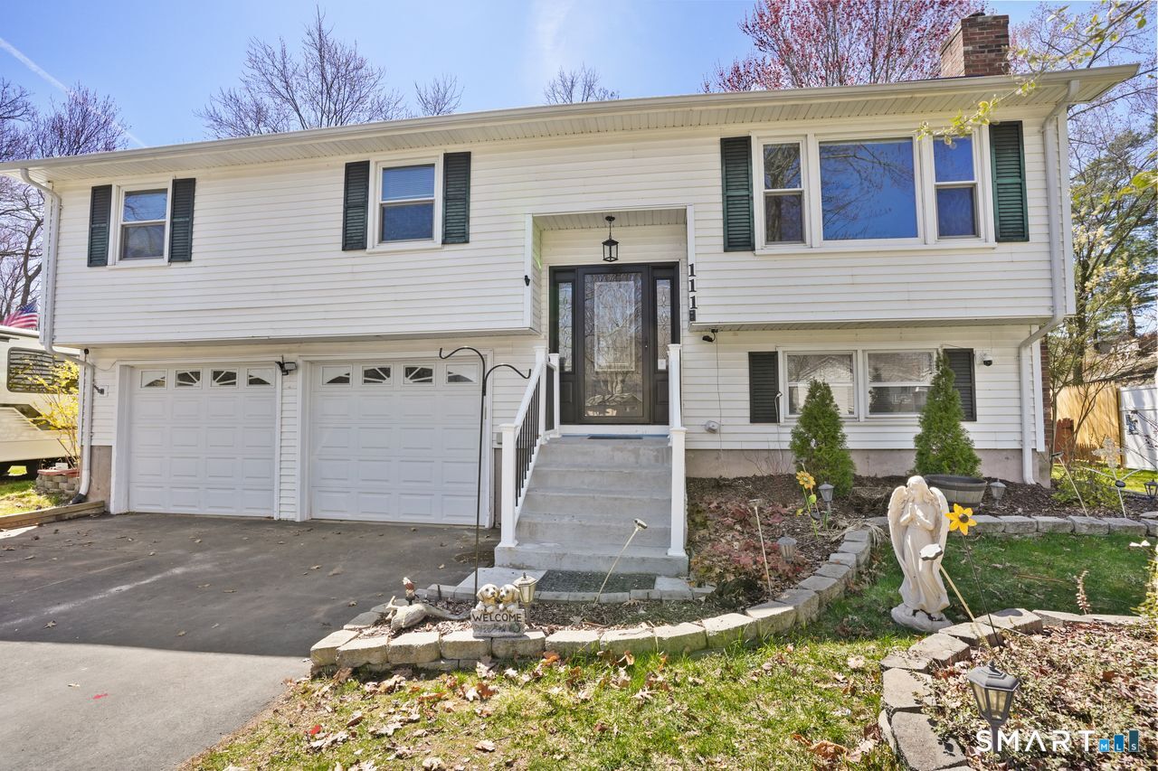 111 Ione Drive Meriden, CT 06450 - Photo 1 of 37 a front view of a house with garden
