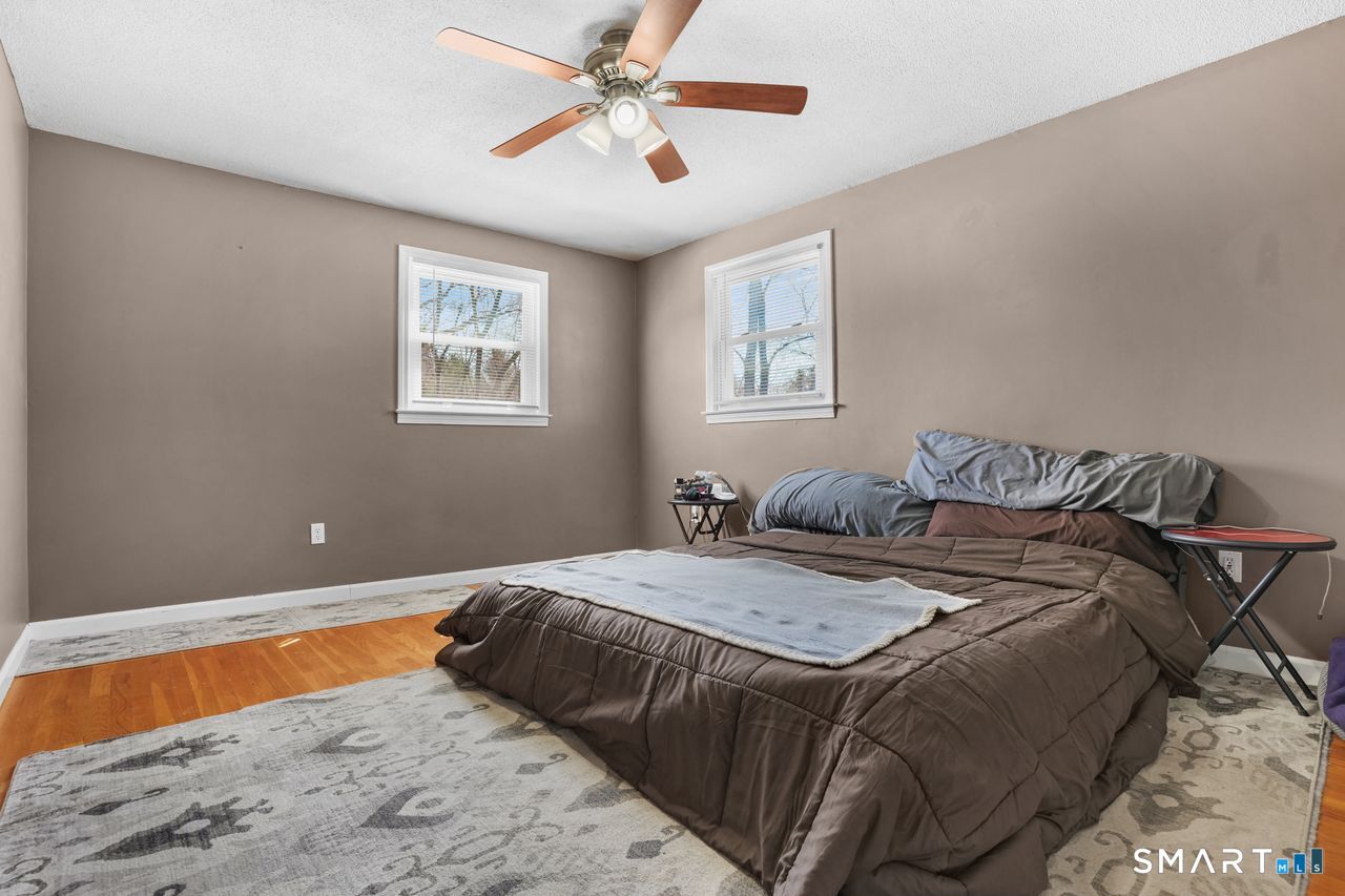 111 Ione Drive Meriden, CT 06450 - Photo 12 of 37 a bed sitting in a bedroom next to a window