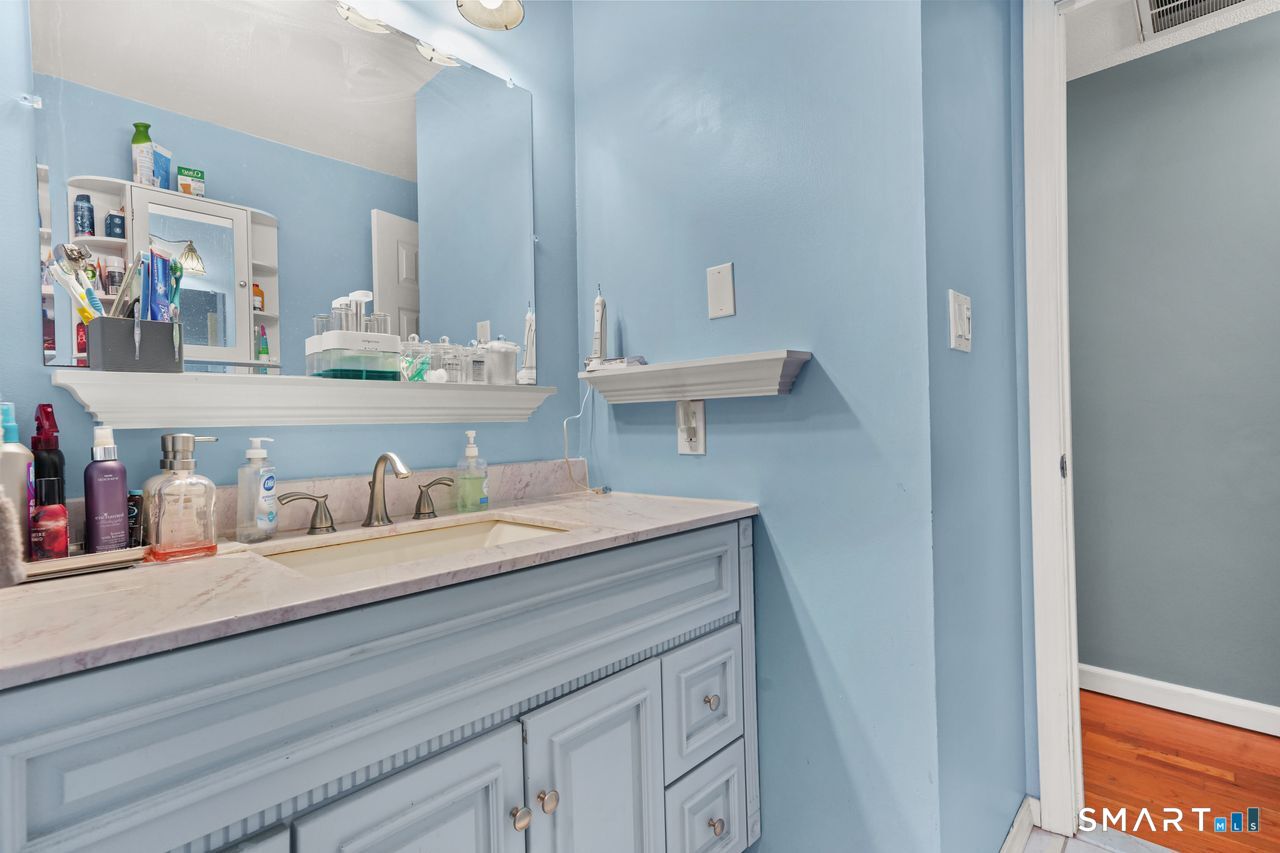 111 Ione Drive Meriden, CT 06450 - Photo 14 of 37 a bathroom with a granite countertop sink and a mirror