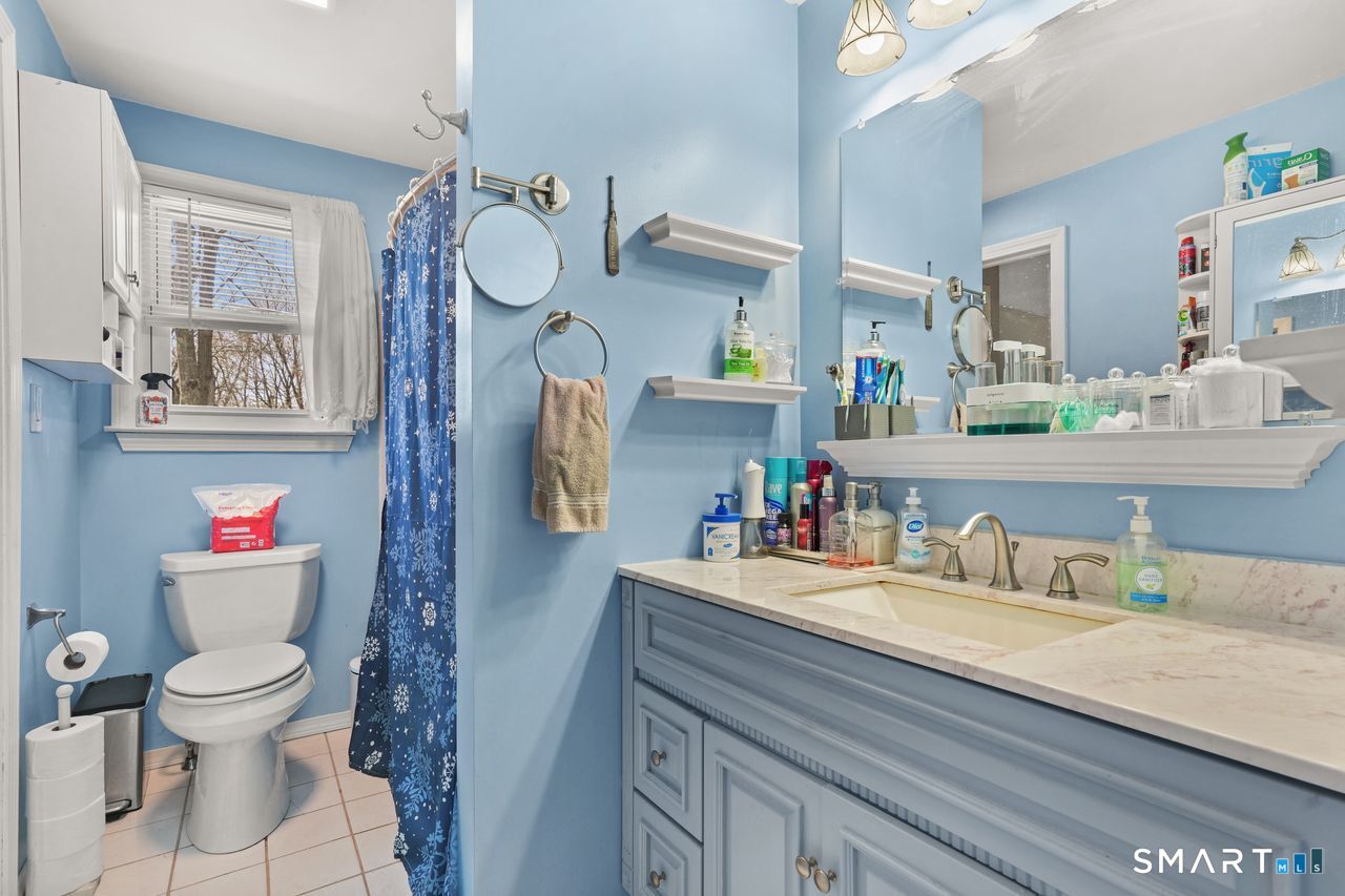 111 Ione Drive Meriden, CT 06450 - Photo 15 of 37 a bathroom with a toilet sink and mirror