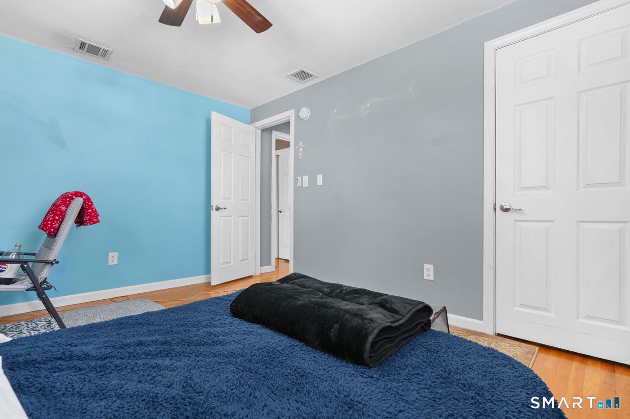 111 Ione Drive Meriden, CT 06450 - Photo 16 of 37 a bedroom with a bed and a window