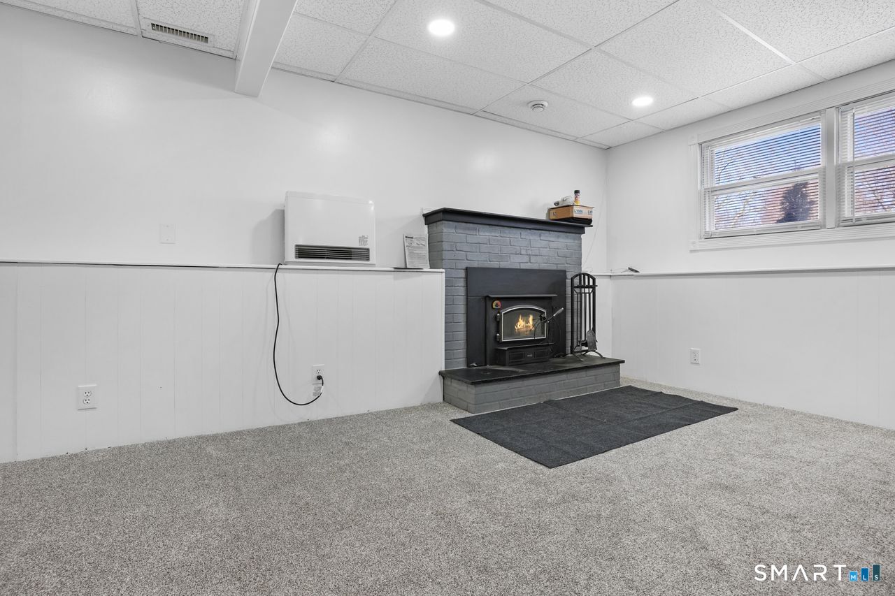 111 Ione Drive Meriden, CT 06450 - Photo 17 of 37 a living room with a fireplace