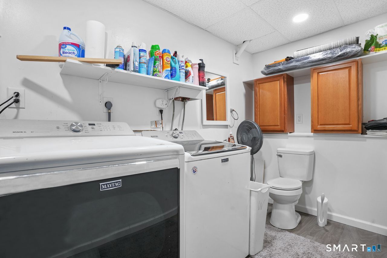 111 Ione Drive Meriden, CT 06450 - Photo 19 of 37 a utility room with a sink a washer and dryer