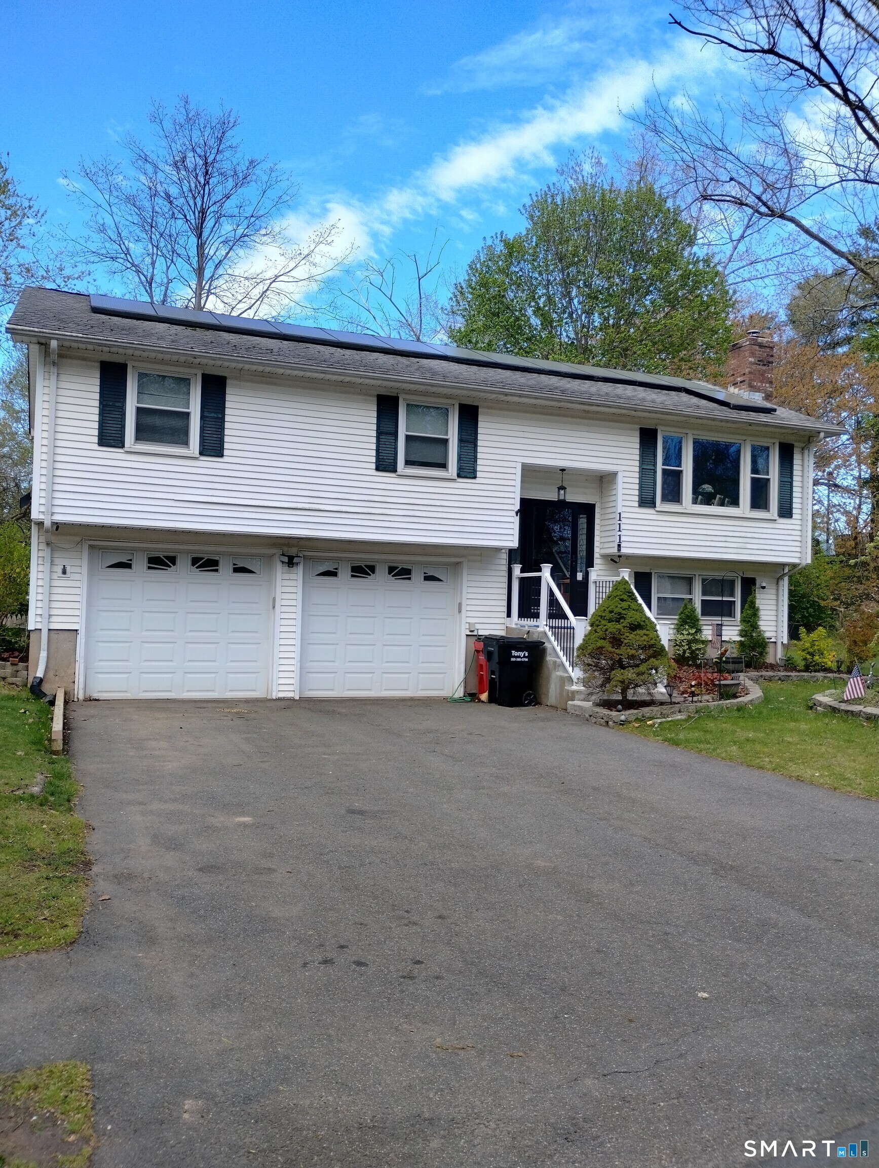 111 Ione Drive Meriden, CT 06450 - Photo 23 of 37 a front view of a house with garden