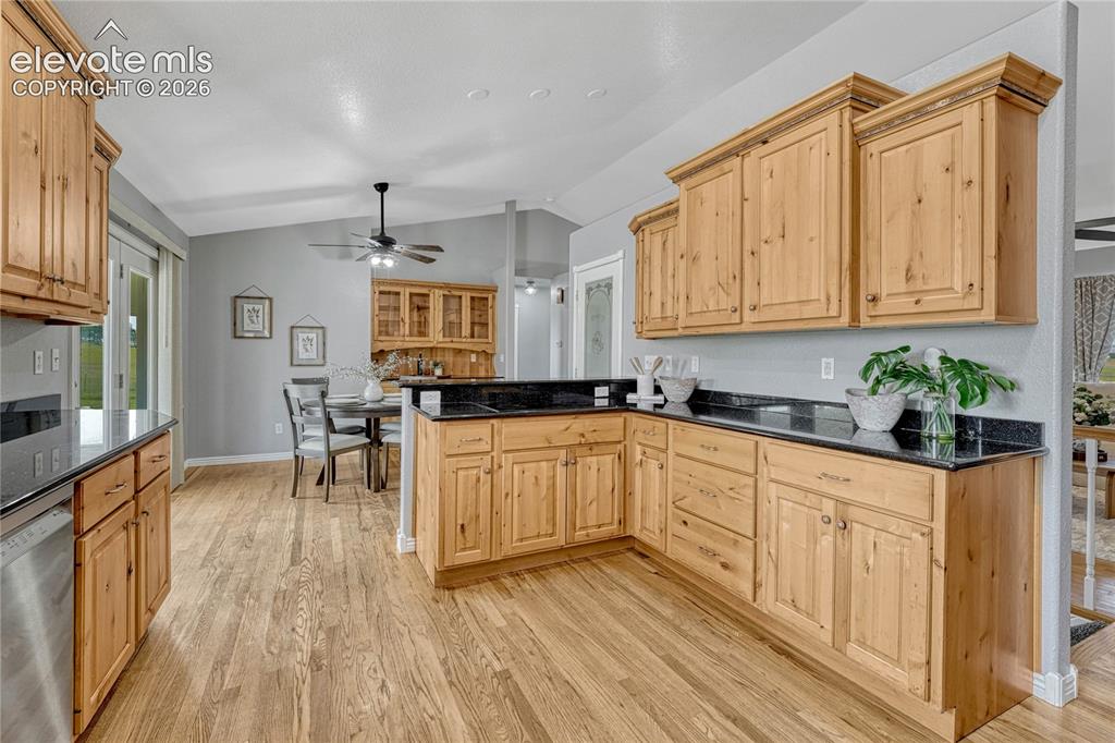 13695 Woodlake Road Elbert, CO 80106 - Photo 8 of 39 Kitchen with oak floors, induction cooktop...