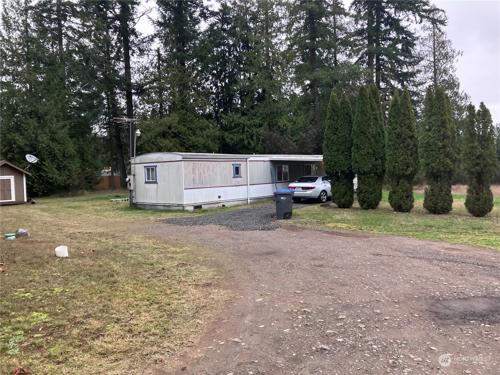 1566 Southwest Old Clifton Road Port Orchard, WA 98367 - Photo 3 of 11 a view of a house with a yard
